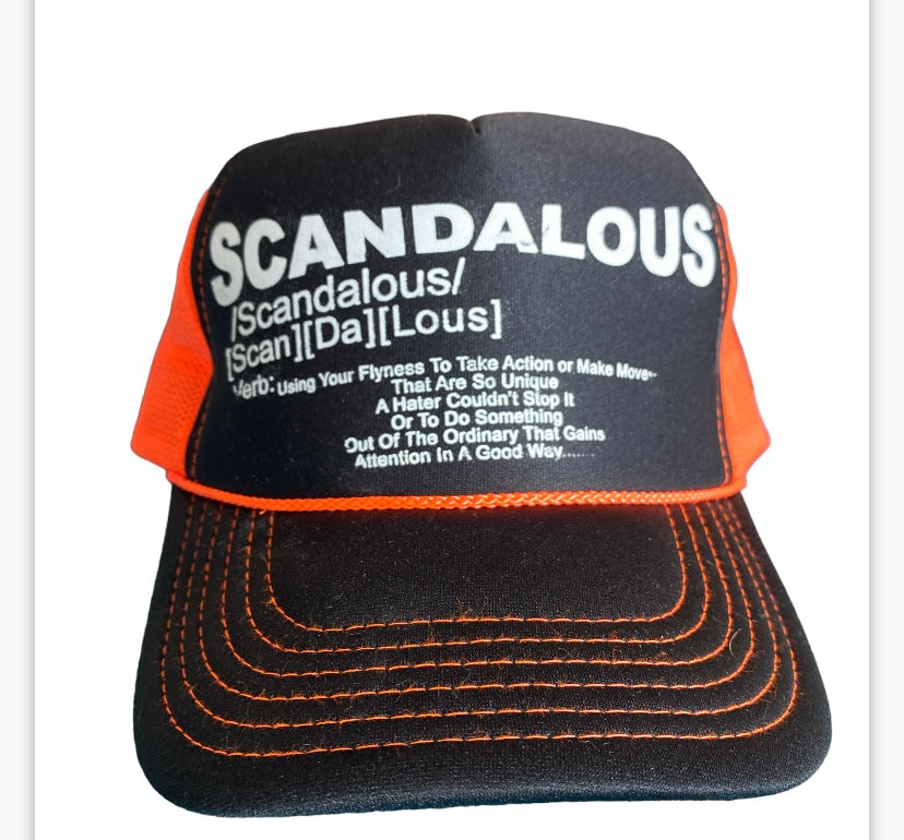 Orange & Black White Writing Scandalous Definition Trucker Hat